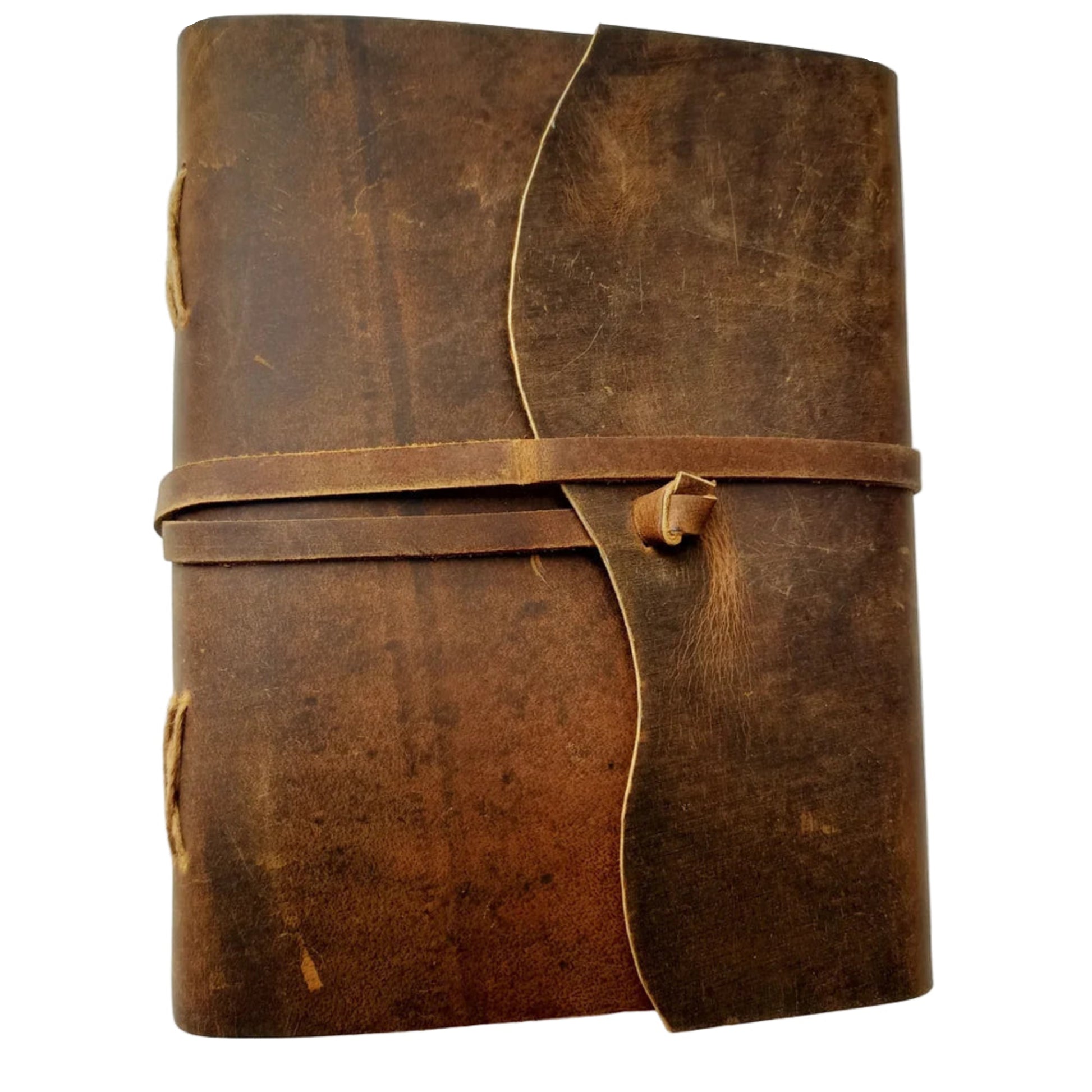 Brown leather journal with a strap closure on a white background